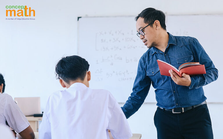 teacher going around classroom guiding students