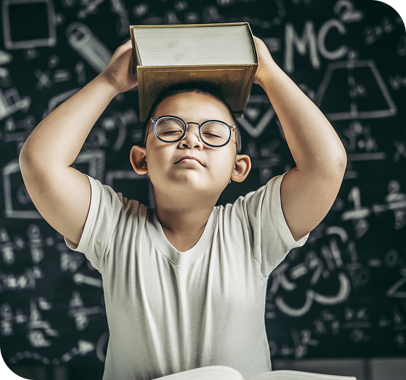 boy-with-glasses-studied-put-book-his-head-classroom